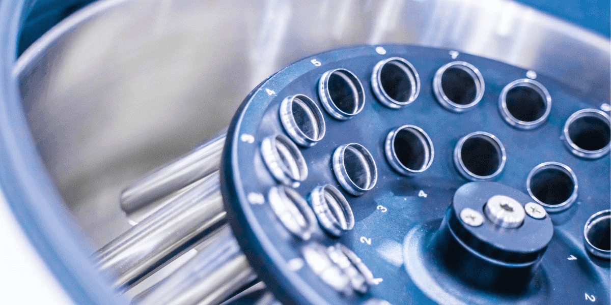 Close-up of a metal machine featuring numerous holes, showcasing its intricate design and industrial functionality.